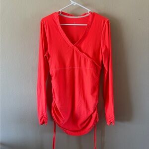 Athleta Neon Orange Tunic Top with Thumbhole sleeves and Ruched sides size M